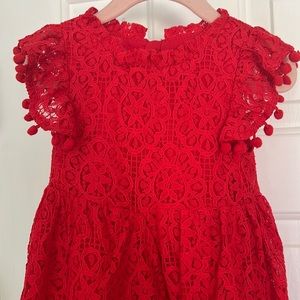 Vibrant Red Toddler Dress with Pom Pom accents. Size 2T.